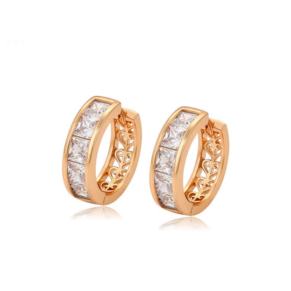 Gold-plated huggie earrings with white crystals - beautiquepoint.com