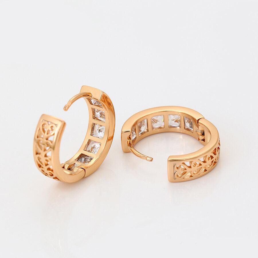 Gold-plated huggie earrings with white crystals - view from different angle - beautiquepoint.com